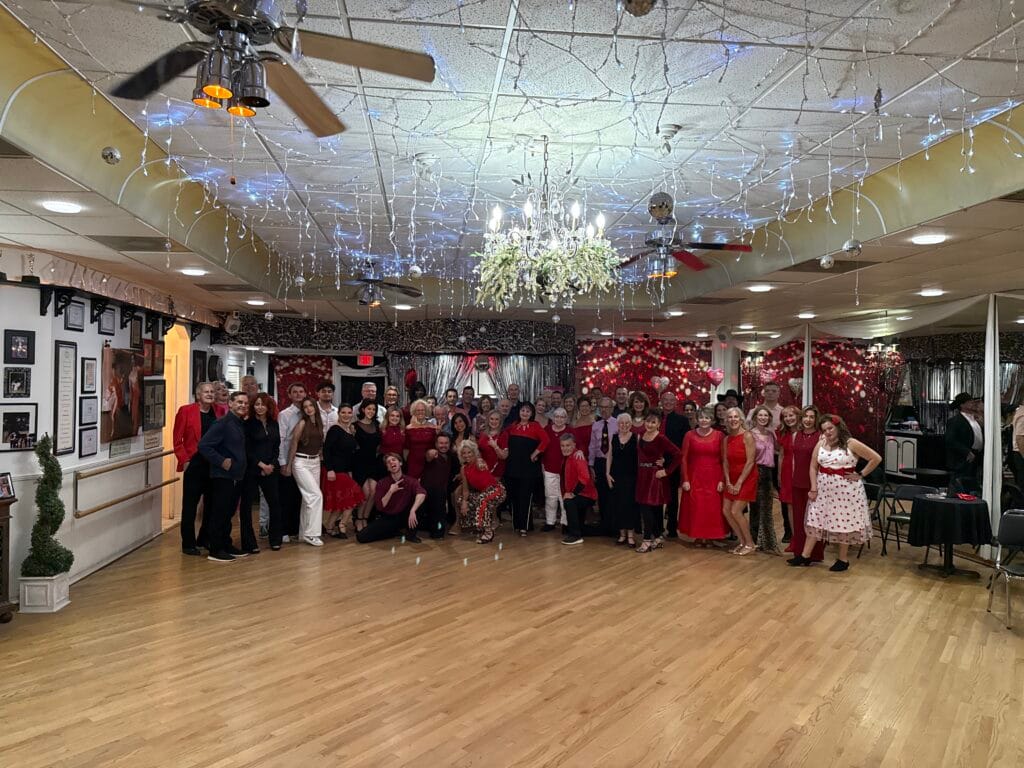 Large group of happy people posing at Valentine’s Day social dance party Sarasota 2026
