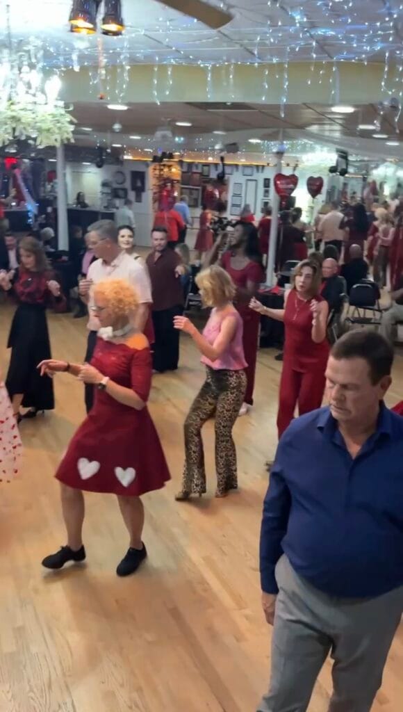 Happy woman dancing and smiling at a social dance event in Sarasota Florida